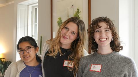 Three students at a HVC event. 